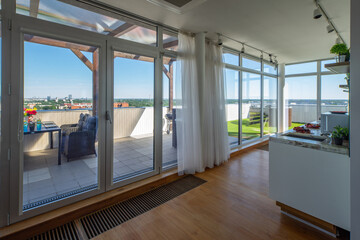 Modern interior of luxury studio apartment with outdoor terrace.