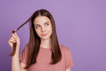 Portrait of interested girl touch fingers chin hair look copyspace think isolated on violet background