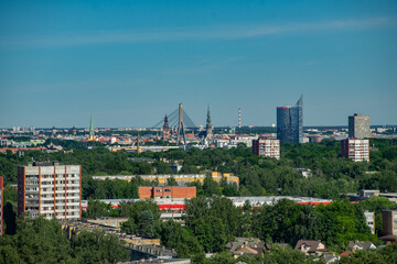Fototapeta na wymiar Summer cityscape of Riga. Top view. Modern urban architecture.