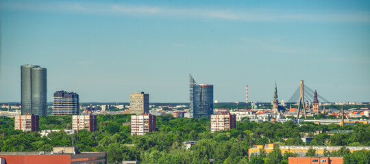 Summer cityscape of Riga. Top view. Modern urban architecture. - obrazy, fototapety, plakaty