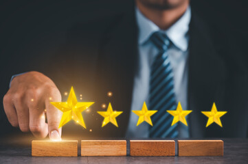 Businessman choose five-star wooden blocks. Satisfaction survey concept. Referral and customer...