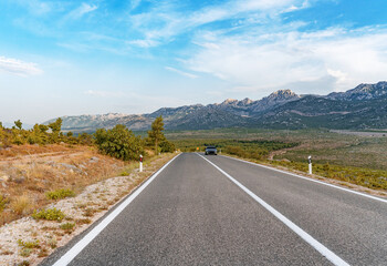 Scenic road. The road is surrounded by a magnificent natural landscape.