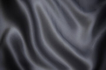 Fototapeta na wymiar Silk or cotton fabric tissue. Dark gray or black color. Texture, background, pattern.