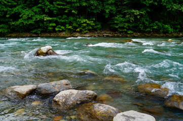 gorgeous turquoise river Passer in Merano in North Italy