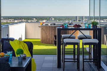 Lounge zone with hot tubon outdoor terrace in modern luxury apartment.
