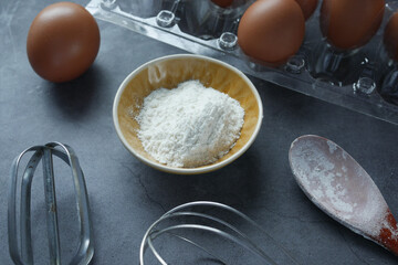 Baking ingredients on a black background,