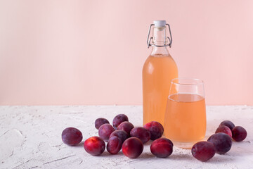plum juice in bottle and glass
