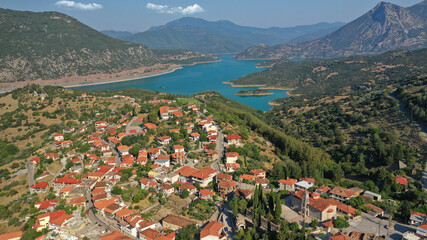 Aerial drone photo of small picturesque village of Lidoriki built near lake and dam of Mornos a...
