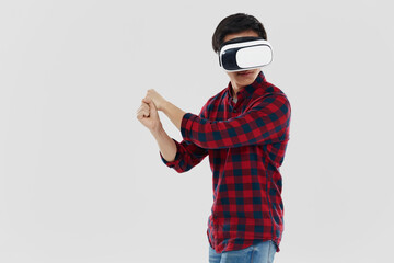 Young asian man using virtual reality glasses