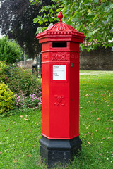 Fototapeta na wymiar Victorian Penfold pillar box in Tetbury town, The Cotswolds, Gloucestershire, England, United Kingdom