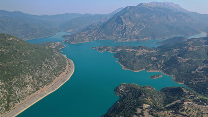 Obraz premium Aerial drone photo of huge fjord looking lake of Mornos a clear water supply for Attica region, Fokida prefecture, Greece