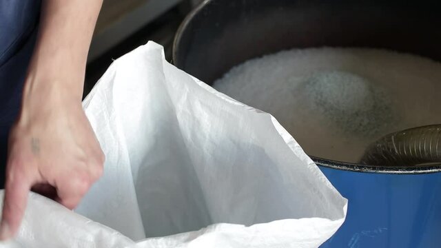 Man hand holding and mixes PP Pet Chips Semi Dull, PET chips recycle, PET polyester chips