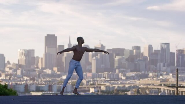 Graceful ballet dancer jumping and twirling in the air. San Francisco