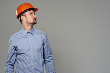 Man orange helmet engineer safety isolated background