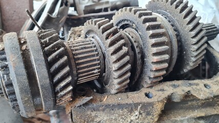 an old rusty gearbox of an industrial machine