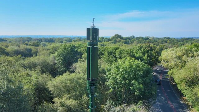 5G mast in the countryside on bright sunny day.