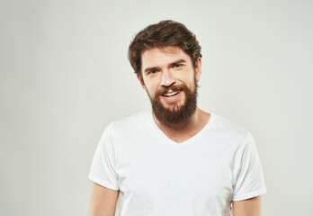 Obraz premium bearded man in white t-shirt emotions anger expression