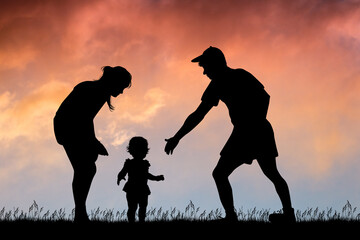 the family with the little girl taking her first steps