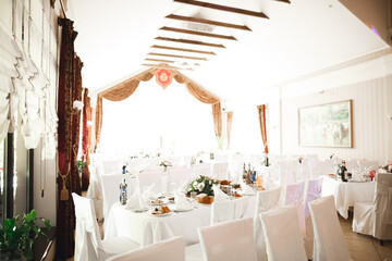 Interior of a restaurant prepared for wedding ceremony