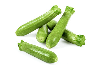 Fresh harvest baby zucchini or courgette from the organic garden on white background