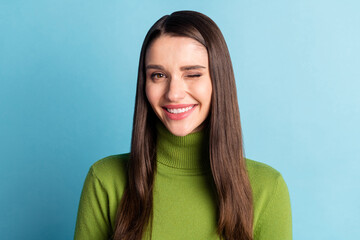 Portrait of attractive cheerful girl winking you flirting good mood isolated over bright blue color...