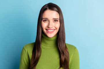 Portrait of nice cheerful content girl secretary assistant wearing warm jumper isolated over bright blue color background