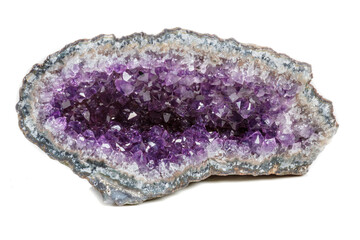 Macro Mineral Stone Amethysts in the rock on a white background