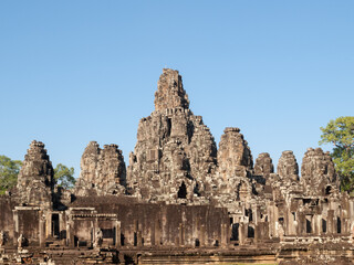 Fototapeta na wymiar Bayon, Siem Reap, Cambodia - built by Jayavarman VII with 54 towers with 216 smiling faces