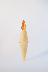 ice cream cone standing on top of each other on a white background.end of summer or autumn beginning concept design idea