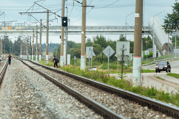Fototapeta premium the railway tracks stretch into the distance to the horizon. gravel is poured on the sleepers between the rails. there are no trains on the tracks. railway transport highway