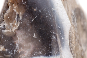 Macro mineral stone Flint in the rock on a white background