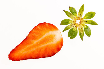 Half-sliced strawberry with the calyx isolated on a white surface
