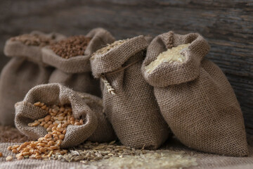 Grains of peas, rice, wheat, oats, buckwheat in bags.