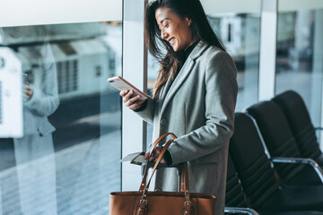 Business traveler waiting for her plane at airport