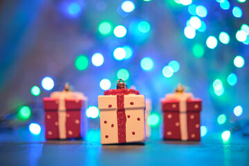 Christmas tree toys on a blue surface with a blurred background