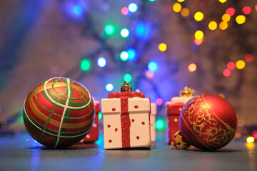 Christmas tree toys on a blue surface with a blurred background