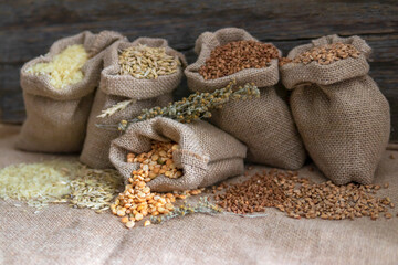 Grains of peas, rice, wheat, oats, buckwheat in bags.