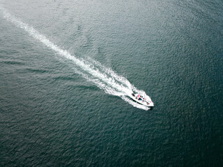 Boat moving through ocean, drone Hong Kong