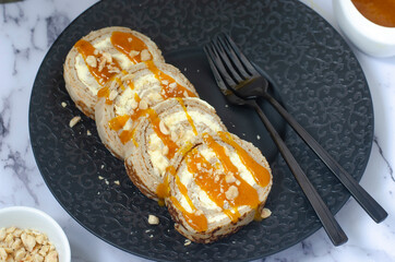 Sweet roll with cream cheese and nuts