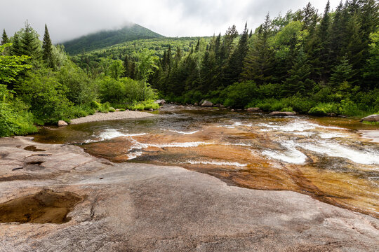 Water of Nesowadnehunk stream flows over the rocks of Ledge Falls in Baxter State Park, Maine
