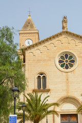 Fototapeta premium Beautiful building of the parish Church of Nativity of Mary in spanish . The small Roman Catholic church is located on the only square of this small historical village.