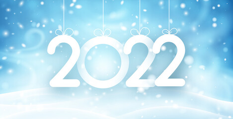 Hanging 2022 on blue snowy night background.