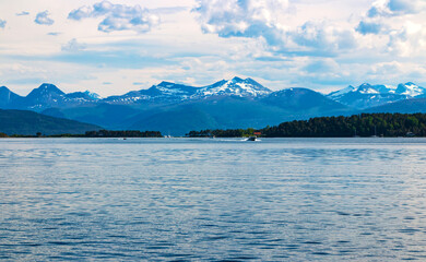 Magnificent water landscape with majestic mountains in the background in the Scandinavian town of...