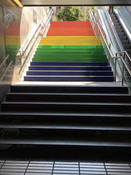 Subway stairs with rainbow flag on the steps