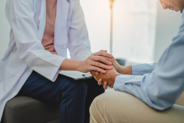psychologist touching patient hands during talking therapy stressed mental health at office