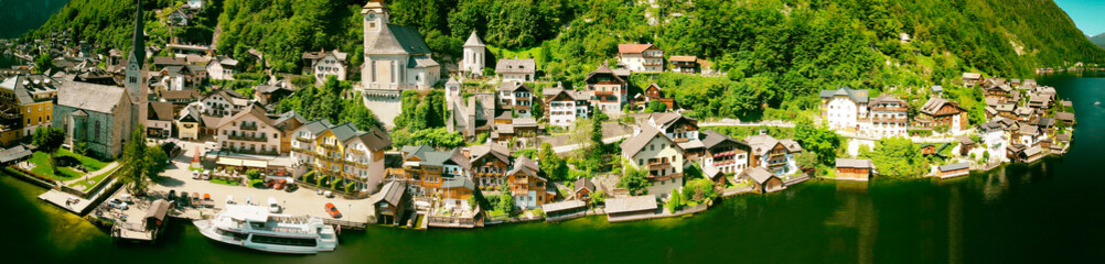 Hallstatt, Austria. Aerial view of the beautiful town from a flying drone over the lake in summer season.