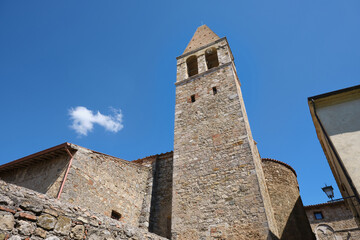 bell tower of the church of san giovanni battista in the village of Magliano in Toscana Tuscany