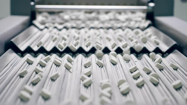 Lines of pills on the factory conveyor