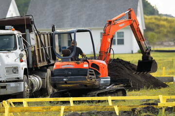 Excavator blue sky heavy machine construction site stock photo