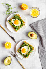Sandwich with eggs avocado cream and spinach, top view